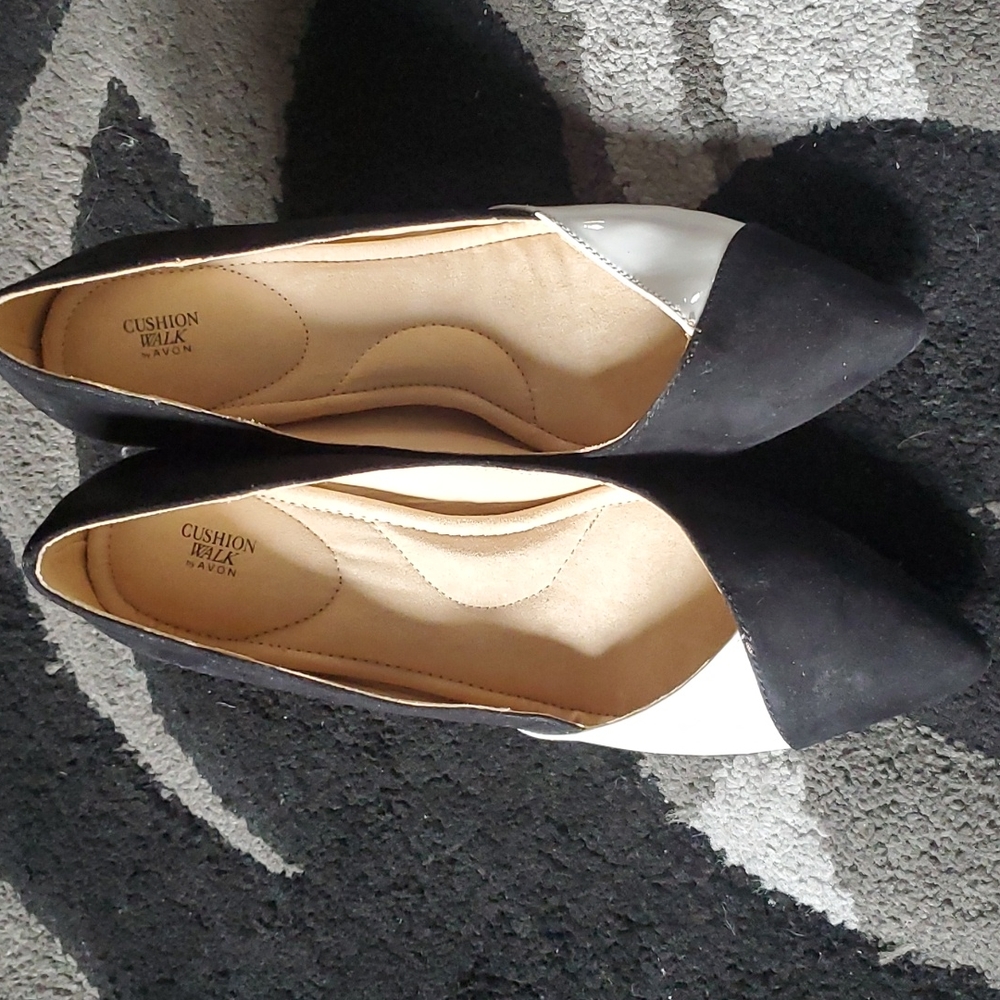 Black and white suede pumps